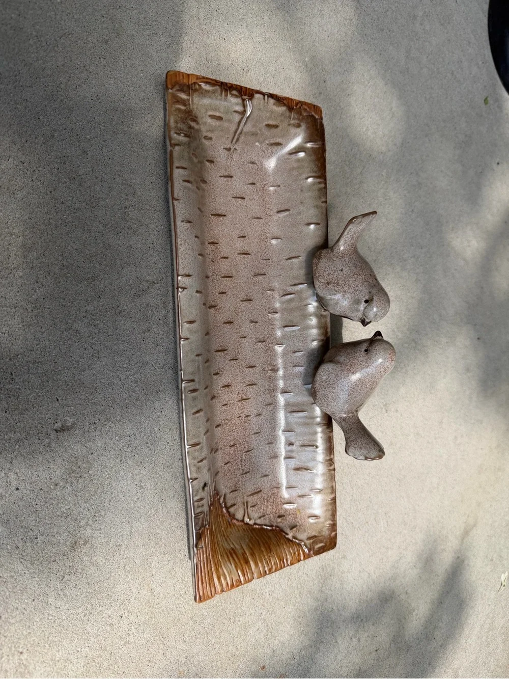 Ceramic bird feeder/tray.